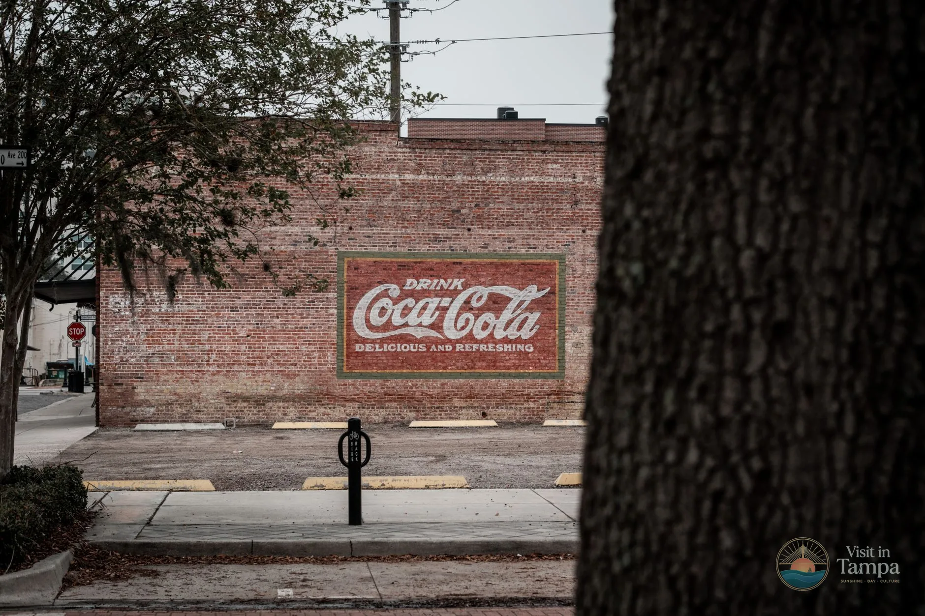 Ybor City street sign with historic brick buildings in Tampa