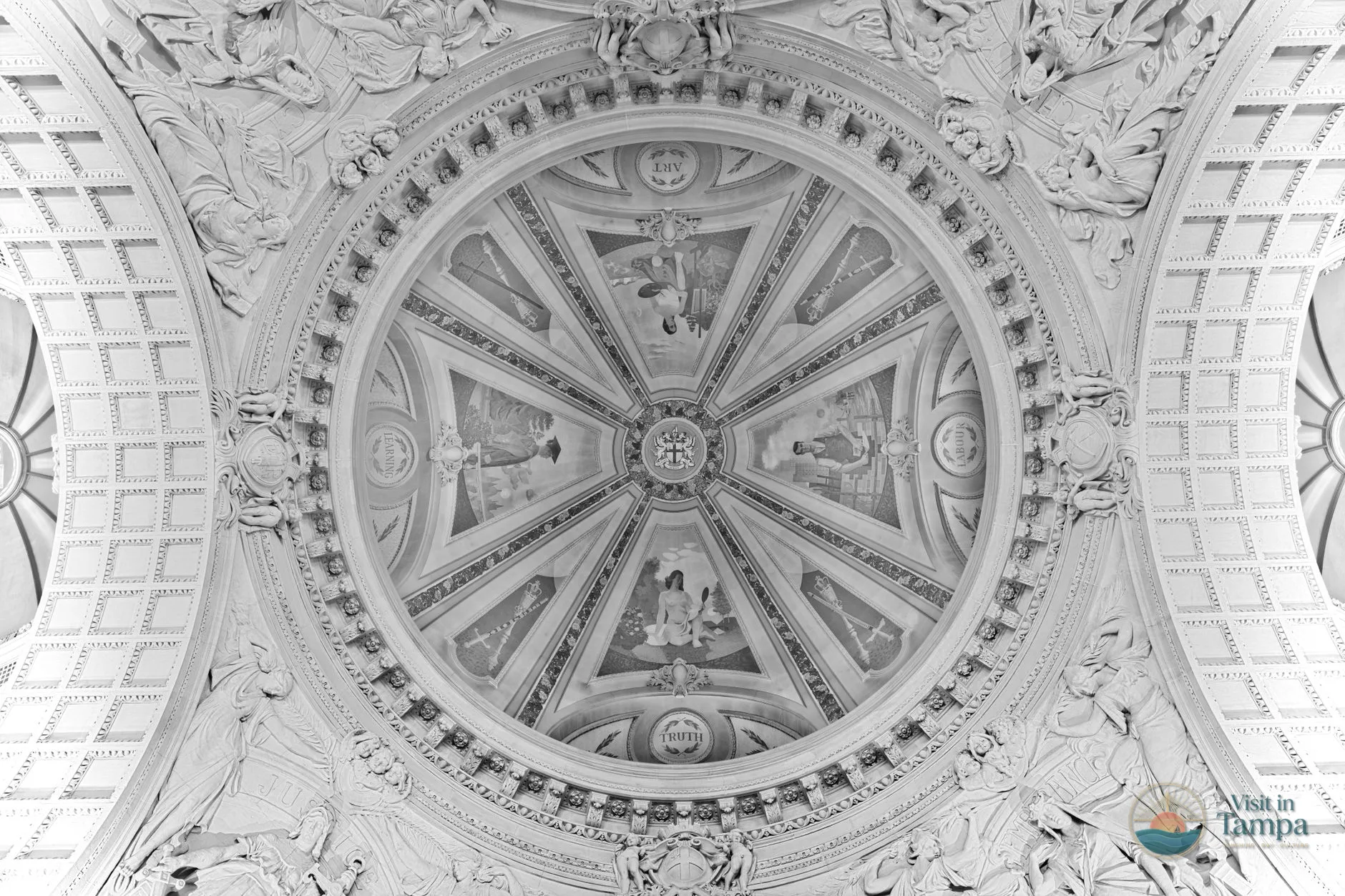 Painted star ceiling, gargoyles, and stage alcove statues inside the Historic Duncan Auditorium at Tampa Theatre