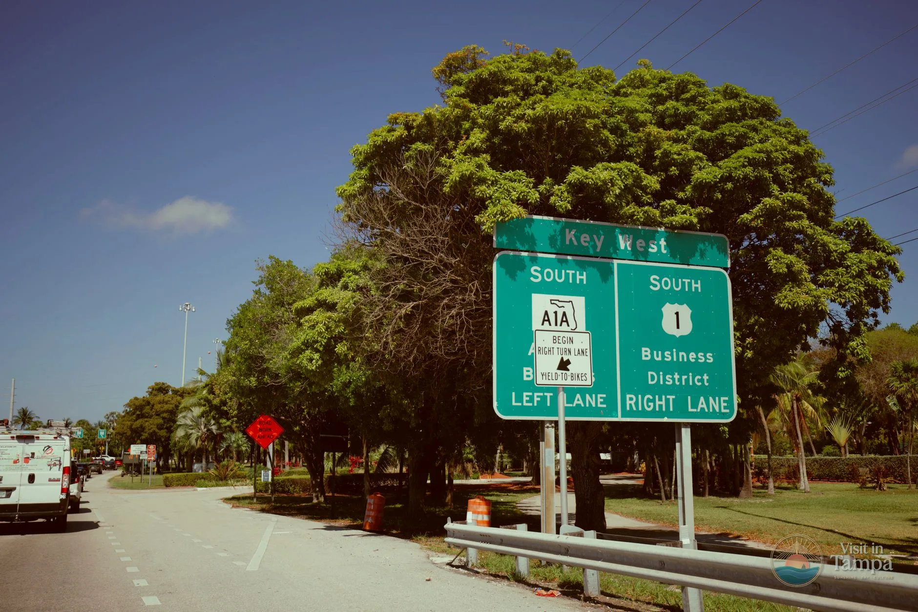 Highway distance sign along I-75 in Southwest Florida showing miles to Naples
