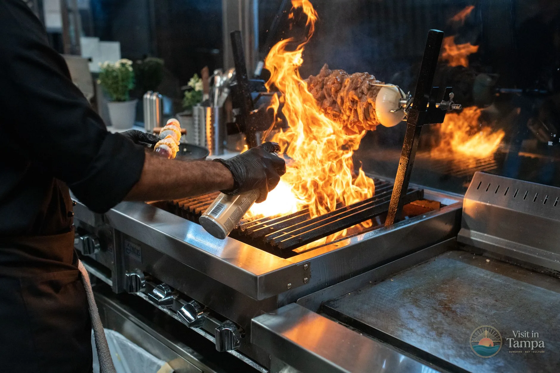Barbacoa grill at Ulele restaurant with food cooking over the flames