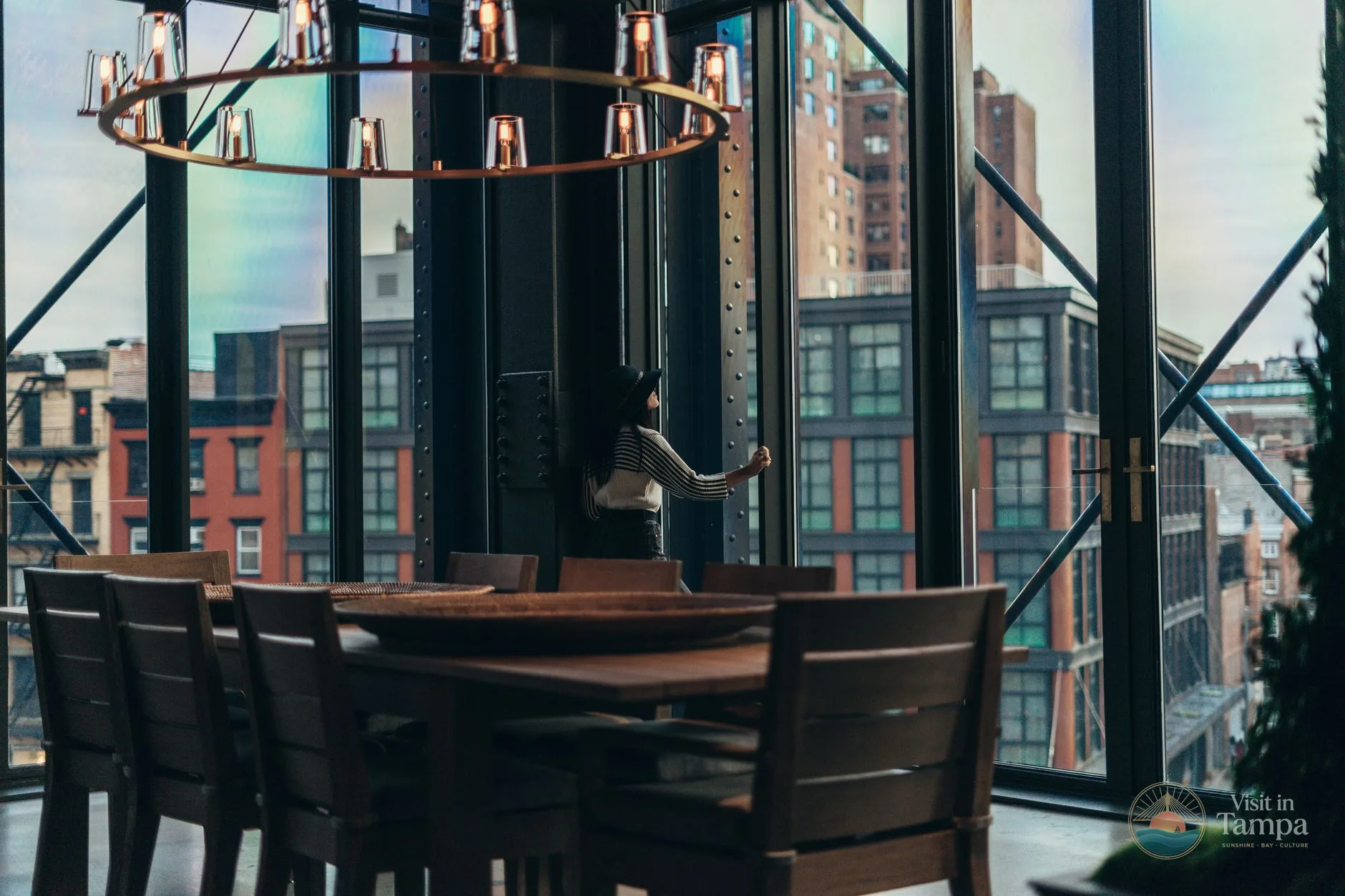 Penthouse suite at The Tampa EDITION with floor-to-ceiling windows overlooking Tampa Bay
