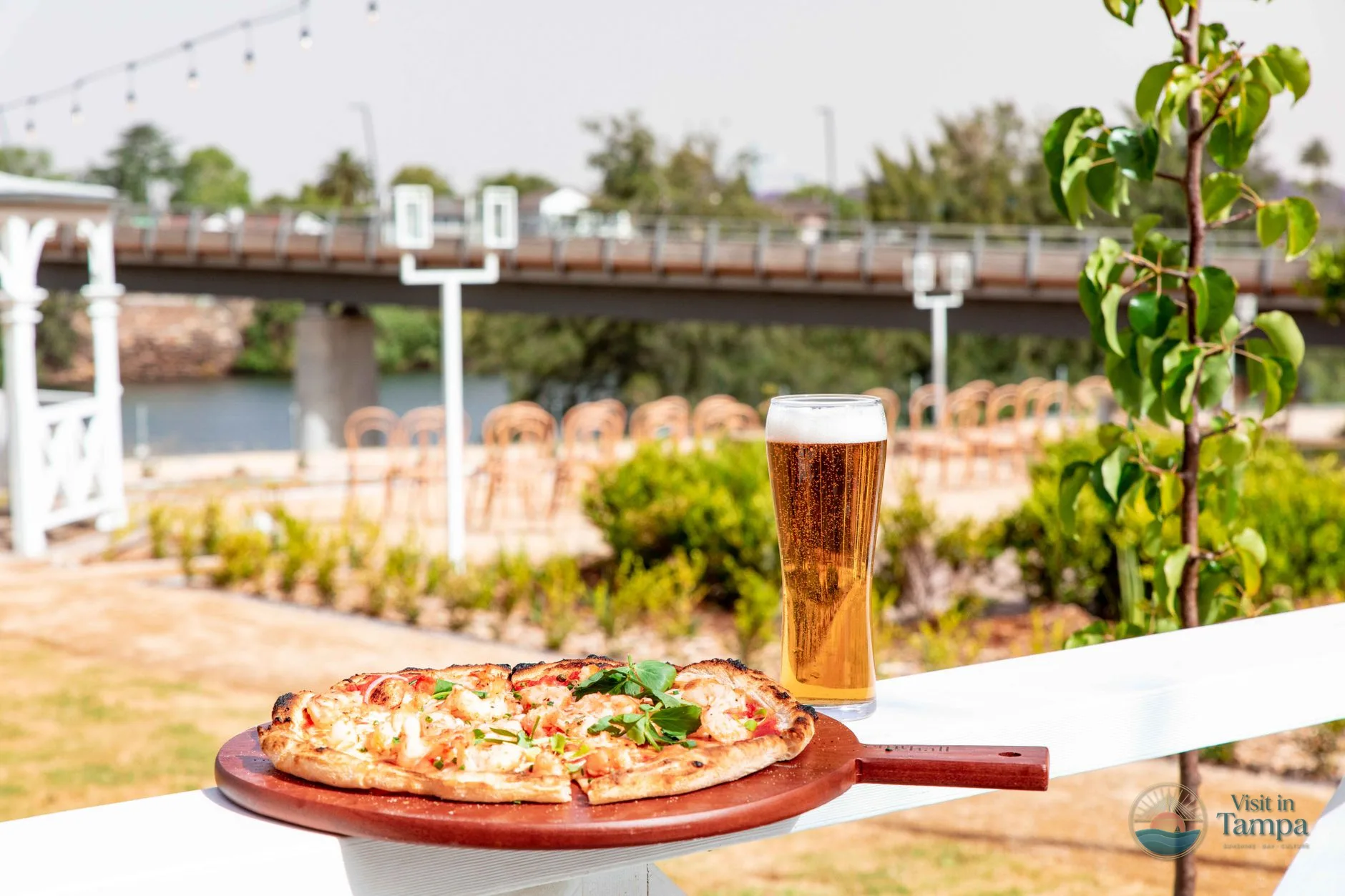 Dining room and riverside patio at Ulele with the Hillsborough River in the background